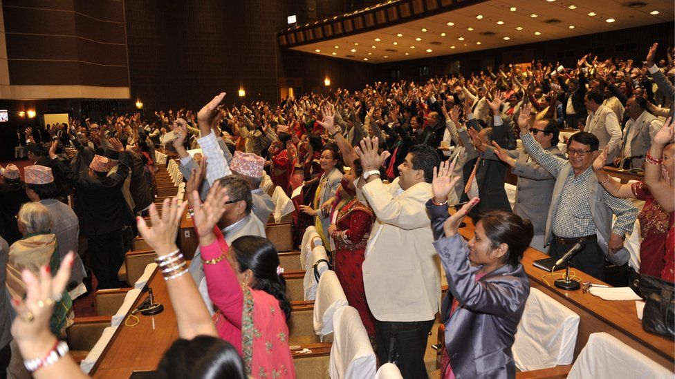 politicians standing in samsad and clapping hand